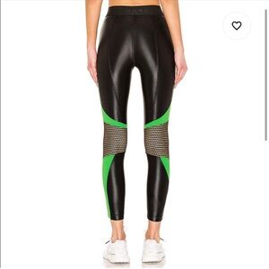 Koral Emblem Infinity Cropped Leggings in black and verde with mesh inserts